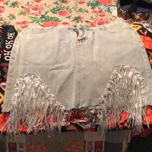 Denim mini skirt with blinged fringe. Brand new never worn.  Sized wrong